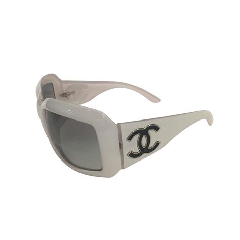 chanel sunglasses with white trim.